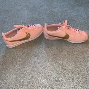 Women’s Nike pink and gold Cortez sneakers